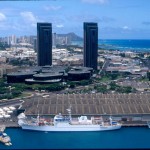 Ship docked alongside the Foreign-Trade Zone with Honolulu and Diamond Head in the background